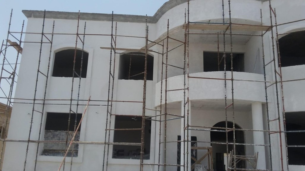 Momentum FN25 exterior application in progress on a private villa